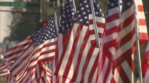 Flags along Main Street in downtown New Prague, Minnesota for the funeral procession of Marine Lance Cpl. Dale Means on November 28, 2012.